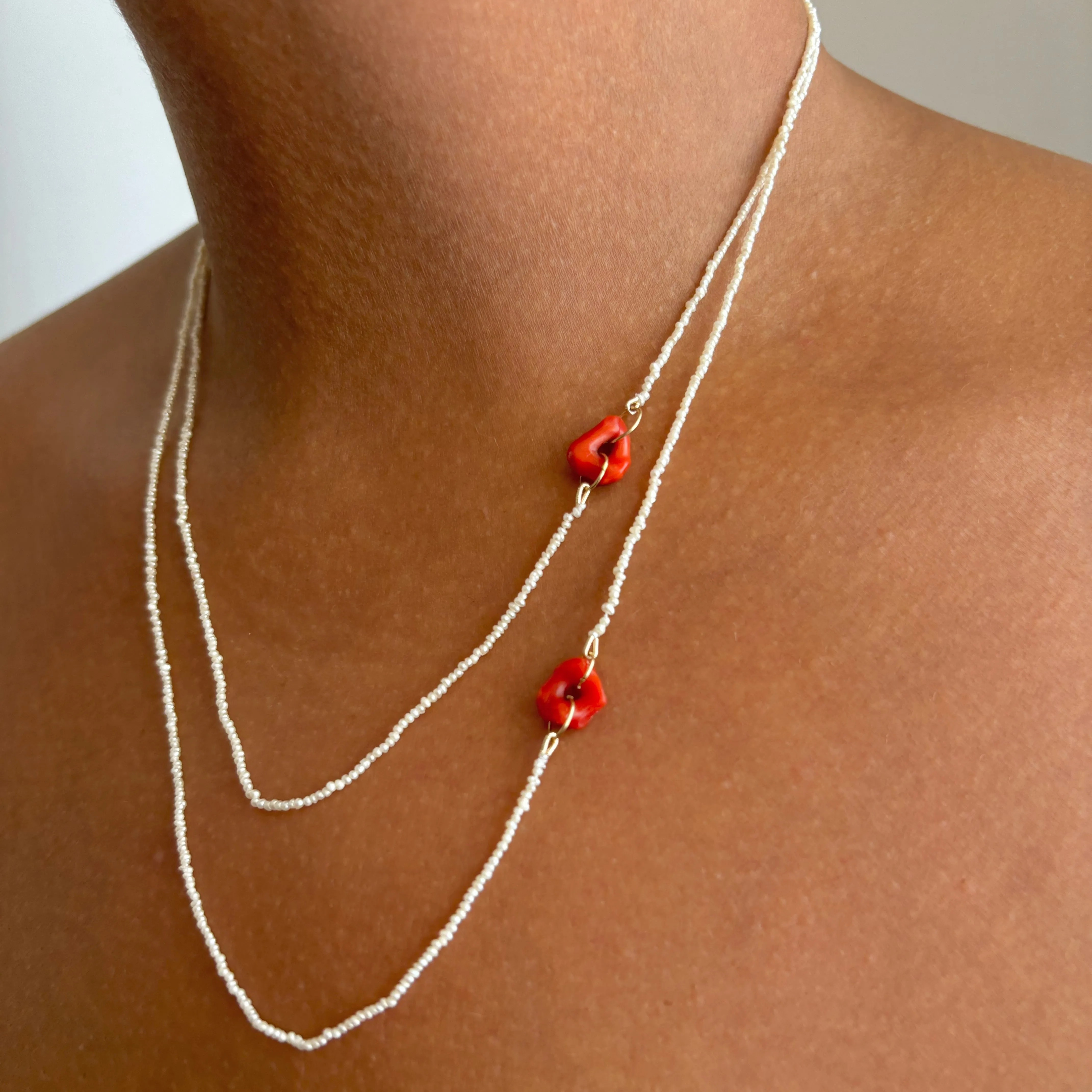 red coral and tiny tiny tiny pearls
