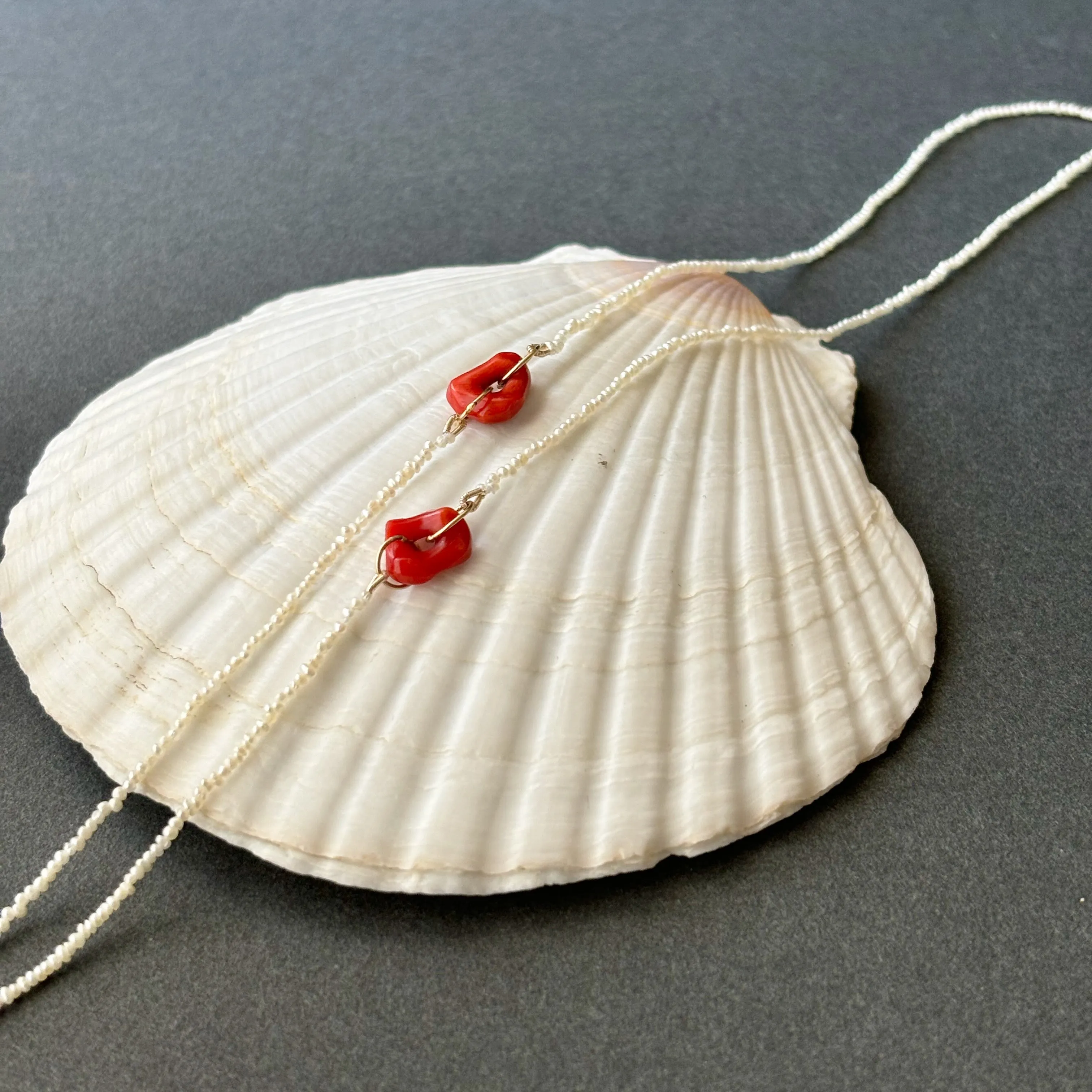 red coral and tiny tiny tiny pearls