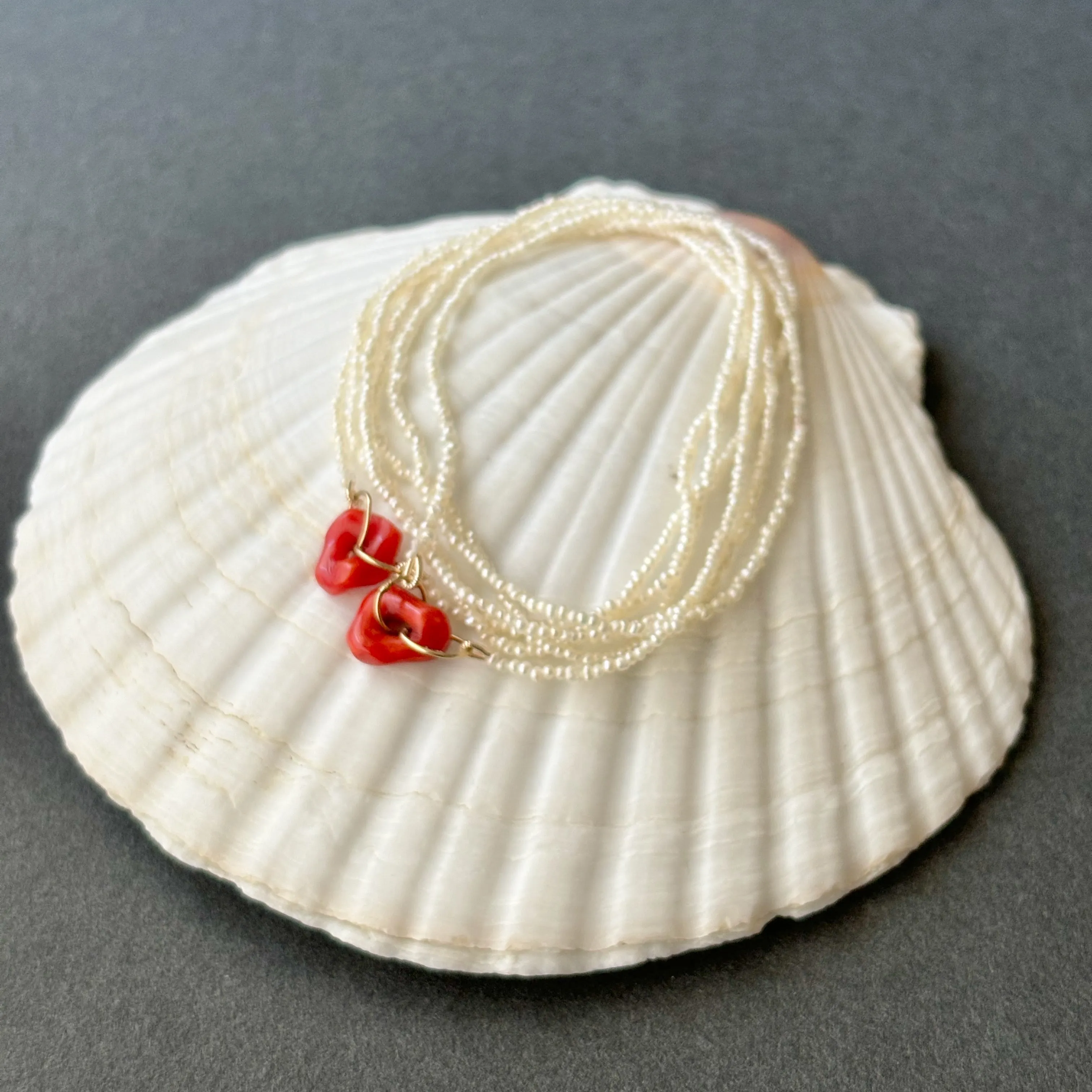 red coral and tiny tiny tiny pearls