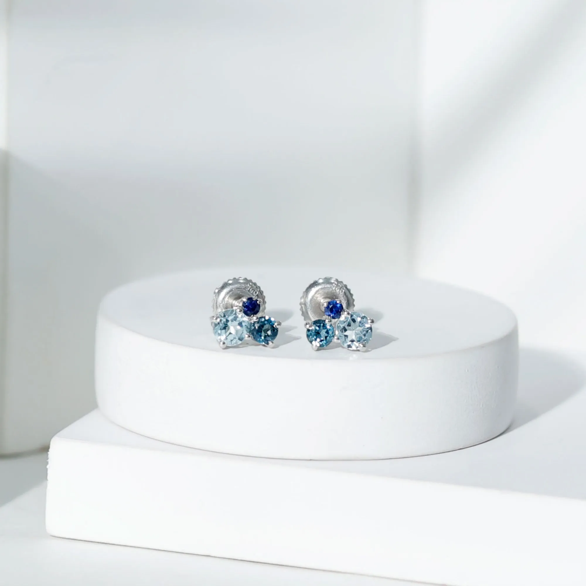 Sky Blue Topaz Three Stone Stud Earrings with London Blue Topaz and Blue Sapphire