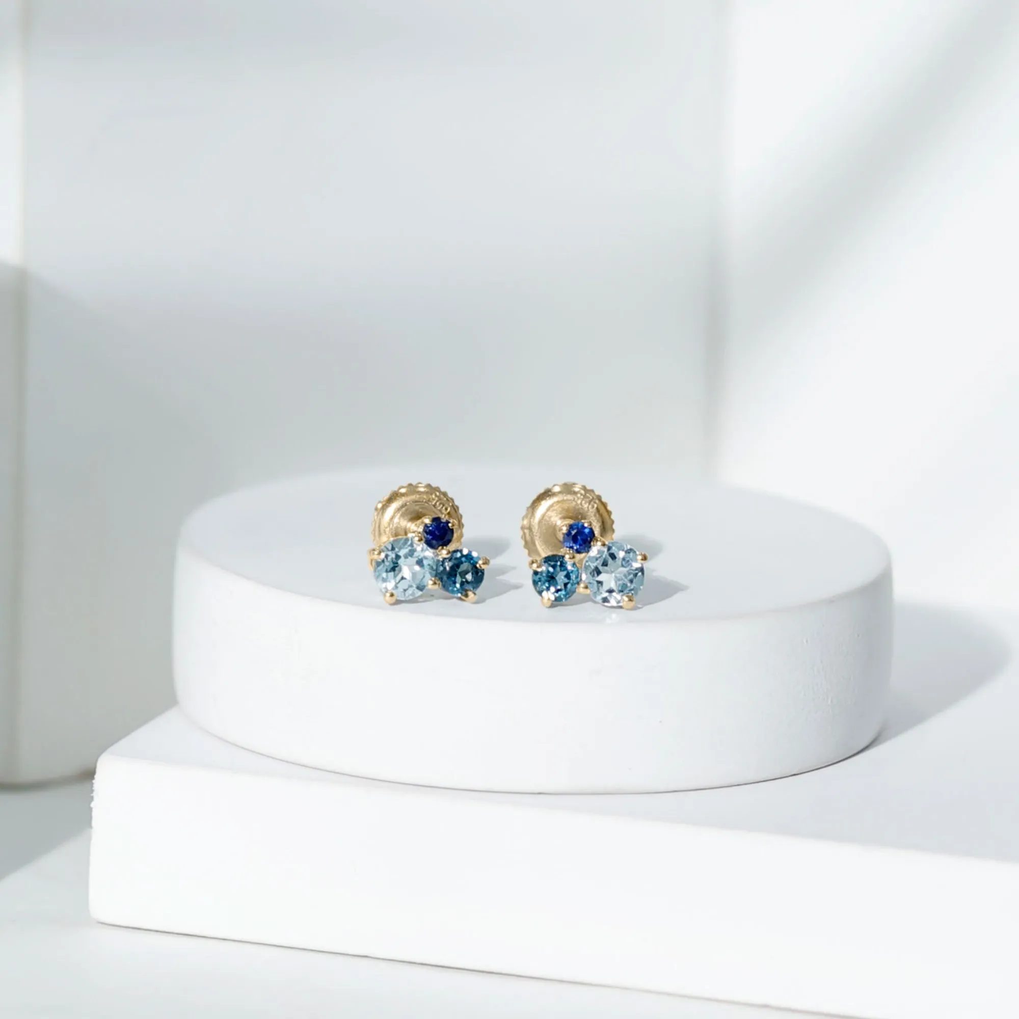 Sky Blue Topaz Three Stone Stud Earrings with London Blue Topaz and Blue Sapphire